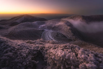 Scenic view of landscape against sky during sunset