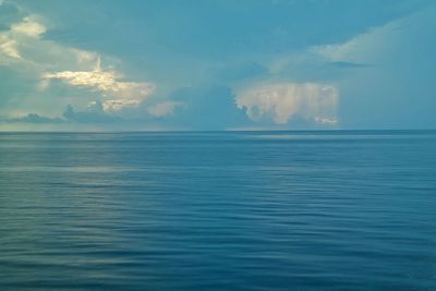 Scenic view of sea against blue sky