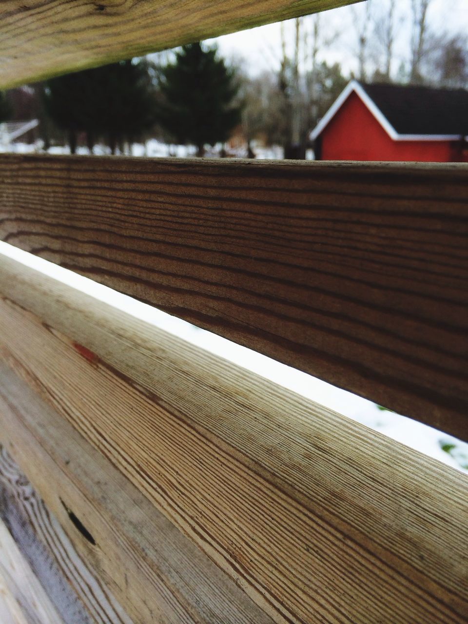 building exterior, built structure, architecture, focus on foreground, close-up, wood - material, house, day, window, wooden, selective focus, no people, outdoors, cropped, part of, sunlight, residential structure, red, protection, tree