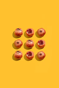 Directly above shot of fruits against yellow background