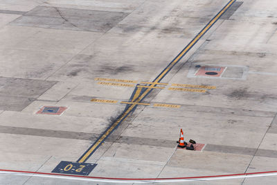 High angle view of airplane on airport runway