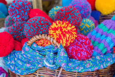 Close-up of multi colored hats in fair 