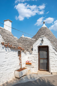 Group of beautiful trulli, traditional apulian dry stone wall hut old houses with a conical roof