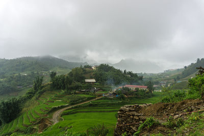 Scenic view of rice terrace against sky during foggy weather