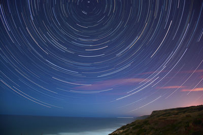 Scenic view of sea against sky at night