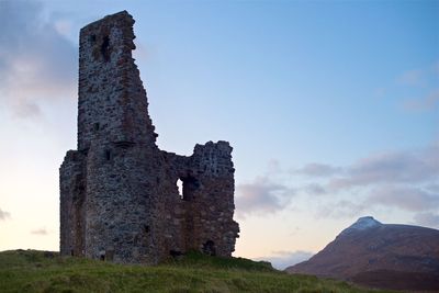 Low angle view of old ruin building against sky