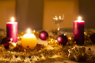 Lit candles on table