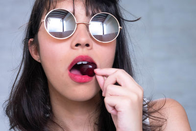 Portrait of young woman wearing sunglasses