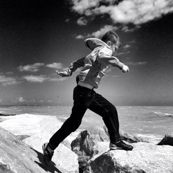 Woman jumping on beach