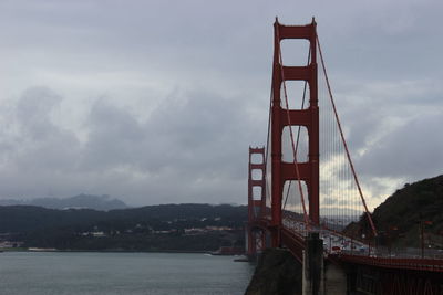 Golden gate bridge over sea against sky