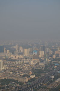 High angle view of buildings in city against clear sky