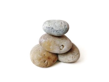 Close-up of stones against white background
