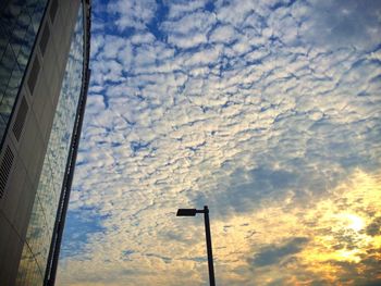 Low angle view of cloudy sky at sunset
