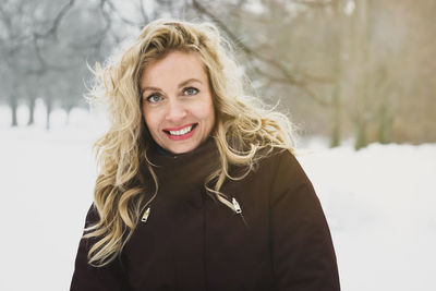 Portrait of smiling woman in winter