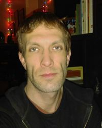Close-up portrait of young man at home