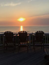 Scenic view of calm sea at sunset