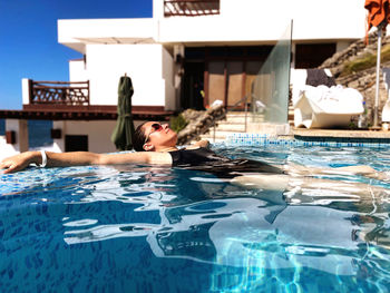 Woman swimming in pool