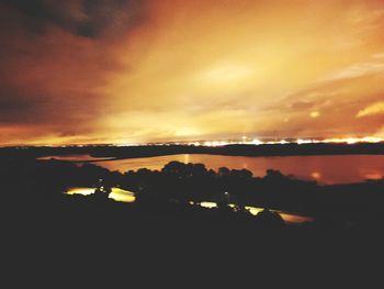 Scenic view of dramatic sky over sea during sunset
