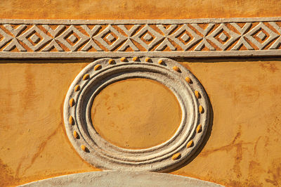 Wall ornament in an old building with sunset light at são sebastião, brazil.