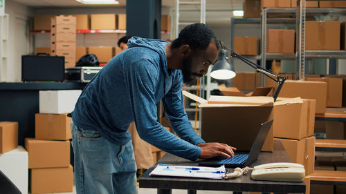 Side view of man working at construction site