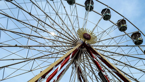 Low angle view of ferris wheel against clear sky