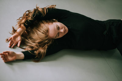 Close-up of young woman relaxing at home