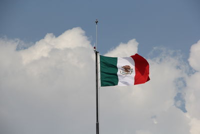 Low angle view of flag against sky