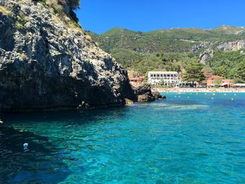 Scenic view of sea against clear blue sky