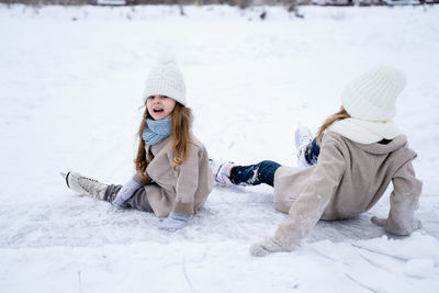 Girl sitting in snow