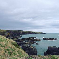 Scenic view of sea against cloudy sky