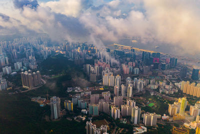 High angle view of buildings in city against sky