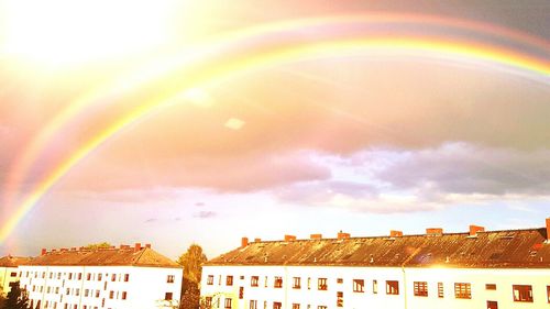 Rainbow over buildings