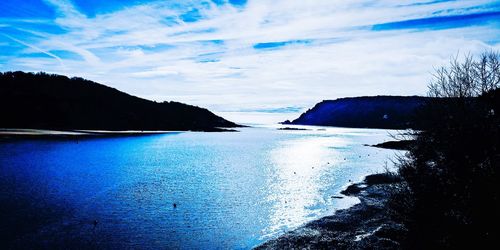 Scenic view of sea against blue sky