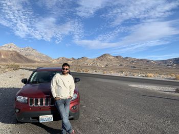 Man on road against sky