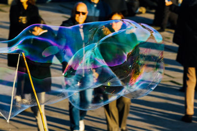 Close-up of bubble over street in city