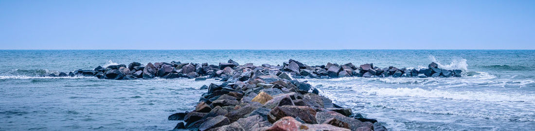 Scenic view of sea against clear sky