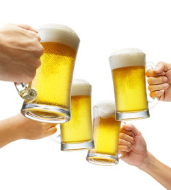 Cropped image of hand holding beer glass