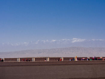 Scenic view of mountains against blue sky