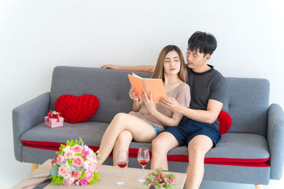 Young couple sitting on sofa