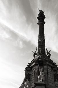 Low angle view of statue against sky