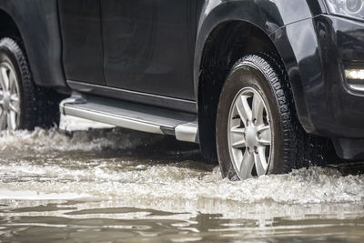 Wet car in city