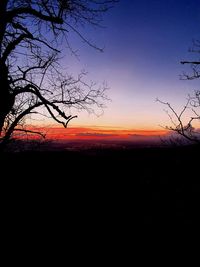 Scenic view of silhouette landscape against sky at sunset