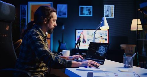 Man using laptop at office