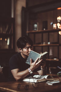 Man sitting on table at home