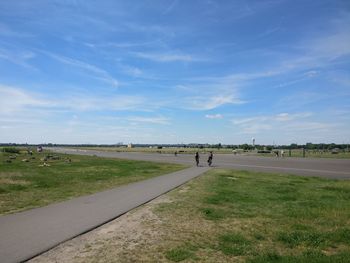 Scenic view of landscape against blue sky