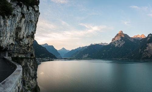 Scenic view of lake and mountains against sky