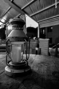 Close-up of gas lantern on table