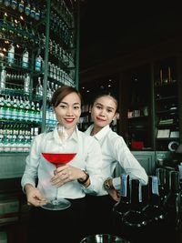Portrait of young couple sitting on table