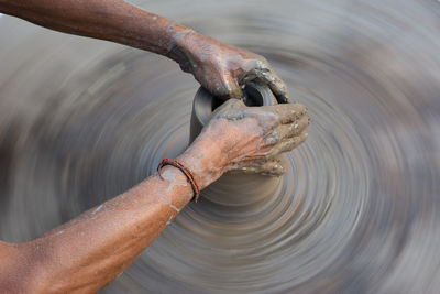 High angle view of man holding water