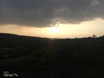 Scenic view of landscape against sky during sunset